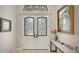 Elegant entryway with double doors and decorative ironwork at 9291 Swaying Branch Rd, Sarasota, FL 34241