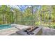 Inviting pool area with firepit and ample space for entertaining at 9291 Swaying Branch Rd, Sarasota, FL 34241