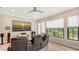 Home theater with leather recliners, large screen, and backyard views at 9291 Swaying Branch Rd, Sarasota, FL 34241