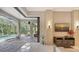Open living space with sliding glass doors leading to the pool and patio at 9291 Swaying Branch Rd, Sarasota, FL 34241