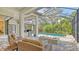 Spacious patio with comfortable seating and a refreshing pool at 9291 Swaying Branch Rd, Sarasota, FL 34241