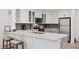 Modern kitchen with gray cabinets and quartz countertops at 2100 Benjamin Franklin Dr # 205, Sarasota, FL 34236