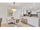 Charming dining area with a round table and kitchen access at 2100 Benjamin Franklin Dr # 205, Sarasota, FL 34236