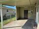 Covered patio with access to backyard at 1202 13Th W Ave, Palmetto, FL 34221