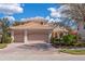 Two-story house with a large double garage and brick driveway at 650 Crane Prairie Way, Osprey, FL 34229