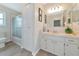 Bathroom with tub, shower, vanity, and linen closet at 1511 Cloister Dr, Sun City Center, FL 33573