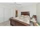 Bedroom with double bed, built-in closet and rocking chair at 1511 Cloister Dr, Sun City Center, FL 33573