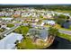 Aerial view of property with water access and lush landscaping at 1511 Cloister Dr, Sun City Center, FL 33573