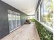 Relaxing screened porch with tiled floor and outdoor seating at 6317 Werner Ave, New Port Richey, FL 34652