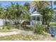Relaxing backyard with a gazebo and a picturesque pond at 6317 Werner Ave, New Port Richey, FL 34652