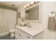 Clean and updated bathroom with a white vanity and geometric tile floor at 6317 Werner Ave, New Port Richey, FL 34652