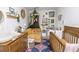 Adorable Bedroom with a crib, changing table, and cozy seating area at 6317 Werner Ave, New Port Richey, FL 34652