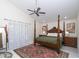 Spacious main bedroom with a large four-poster bed and plenty of natural light at 6317 Werner Ave, New Port Richey, FL 34652