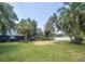 Landscaped backyard with lush tropical plants at 6317 Werner Ave, New Port Richey, FL 34652