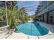 Inviting kidney shaped pool with a spa at 6317 Werner Ave, New Port Richey, FL 34652