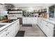 Updated kitchen with white cabinets and quartz countertops at 6317 Werner Ave, New Port Richey, FL 34652