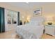 Bright bedroom with a queen-size bed and patio access at 4802 51St W St # 1010, Bradenton, FL 34210