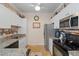 Modern kitchen featuring white cabinets and granite countertops at 4802 51St W St # 1010, Bradenton, FL 34210