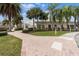 Community clubhouse with palm trees and brick pathways at 4802 51St W St # 1010, Bradenton, FL 34210