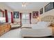 Bedroom with a king-size bed and an antique dresser at 4802 51St W St # 1010, Bradenton, FL 34210