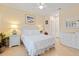 Comfortable bedroom with white bedding and a ceiling fan at 4802 51St W St # 1010, Bradenton, FL 34210