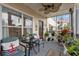 Relaxing screened balcony with seating, plants, and view of trees at 4802 51St W St # 1010, Bradenton, FL 34210