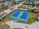 Aerial view of two well-maintained tennis courts at 4802 51St W St # 1010, Bradenton, FL 34210