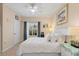 Bedroom with a queen-size bed, window and ceiling fan at 4802 51St W St # 1010, Bradenton, FL 34210