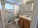 Clean bathroom with shower/tub combo, vanity, toilet, and window at 1570 Pleasant Rd # J-26, Bradenton, FL 34207