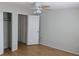 Empty bedroom showcasing wood-look floors and closet with double doors at 1570 Pleasant Rd # J-26, Bradenton, FL 34207