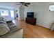 Living room with a couch, dresser, and a view of the dining area at 1570 Pleasant Rd # J-26, Bradenton, FL 34207