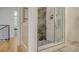 Walk-in shower with marble tile and glass enclosure at 1762 10Th St, Sarasota, FL 34236