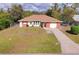 Brick home with attached garage and driveway at 21024 Baffin Ave, Port Charlotte, FL 33954