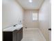 Bright laundry room with washer/dryer hookups and ample storage at 21024 Baffin Ave, Port Charlotte, FL 33954