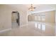 Bright living room with tiled floors and a view into the kitchen at 21024 Baffin Ave, Port Charlotte, FL 33954