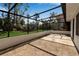 Covered screened lanai offers shade for outdoor living and views of lush landscaping at 2303 89Th Nw St, Bradenton, FL 34209