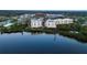 Aerial view showcasing waterfront location and building proximity to water at 236 Hidden Bay Dr # 504, Osprey, FL 34229