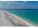 Stunning beachfront property with pristine white sand and clear turquoise water at 236 Hidden Bay Dr # 504, Osprey, FL 34229