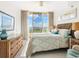 Bright bedroom with water views, king bed, and ample storage at 3070 Grand Bay Blvd # 632, Longboat Key, FL 34228