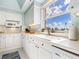 Bright kitchen featuring white cabinetry and a view at 3070 Grand Bay Blvd # 632, Longboat Key, FL 34228