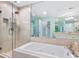 Spa-like bathroom with soaking tub, glass shower, and updated fixtures at 3070 Grand Bay Blvd # 632, Longboat Key, FL 34228