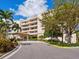 Attractive building exterior with landscaping and driveway at 3070 Grand Bay Blvd # 632, Longboat Key, FL 34228