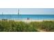 Scenic beach access with dune grasses leading to the ocean at 3070 Grand Bay Blvd # 632, Longboat Key, FL 34228