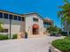 Community clubhouse with inviting entrance and landscaping at 3070 Grand Bay Blvd # 632, Longboat Key, FL 34228
