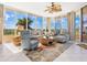 Spacious living room with large windows, comfy furniture, and tile floors at 3070 Grand Bay Blvd # 632, Longboat Key, FL 34228