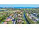 Aerial view of waterfront home with private dock and lush landscaping at 3161 Bayou Sound, Longboat Key, FL 34228