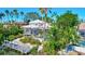 Waterfront property boasts a private pool, dock, and lush landscaping at 3161 Bayou Sound, Longboat Key, FL 34228