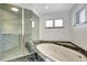 Spa-like bathroom featuring a large shower and jetted tub at 3161 Bayou Sound, Longboat Key, FL 34228