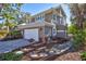 Spacious home with attached garage and manicured landscaping at 3161 Bayou Sound, Longboat Key, FL 34228