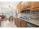 Kitchen features wood cabinets, granite countertops, and stainless steel sink at 3402 36Th W St, Bradenton, FL 34205